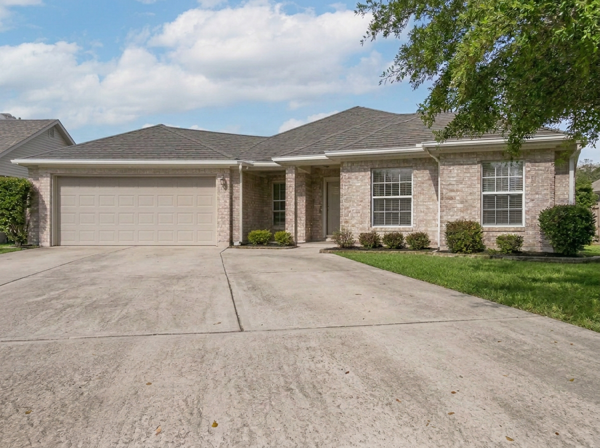Clean, bright concrete driveway after pressure washing